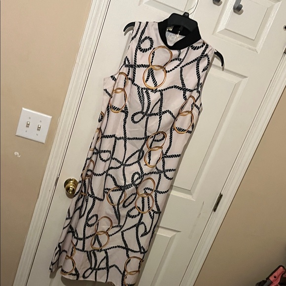 WoWo Dresses & Skirts - Chic Black and Gold Patterned Midi Dress